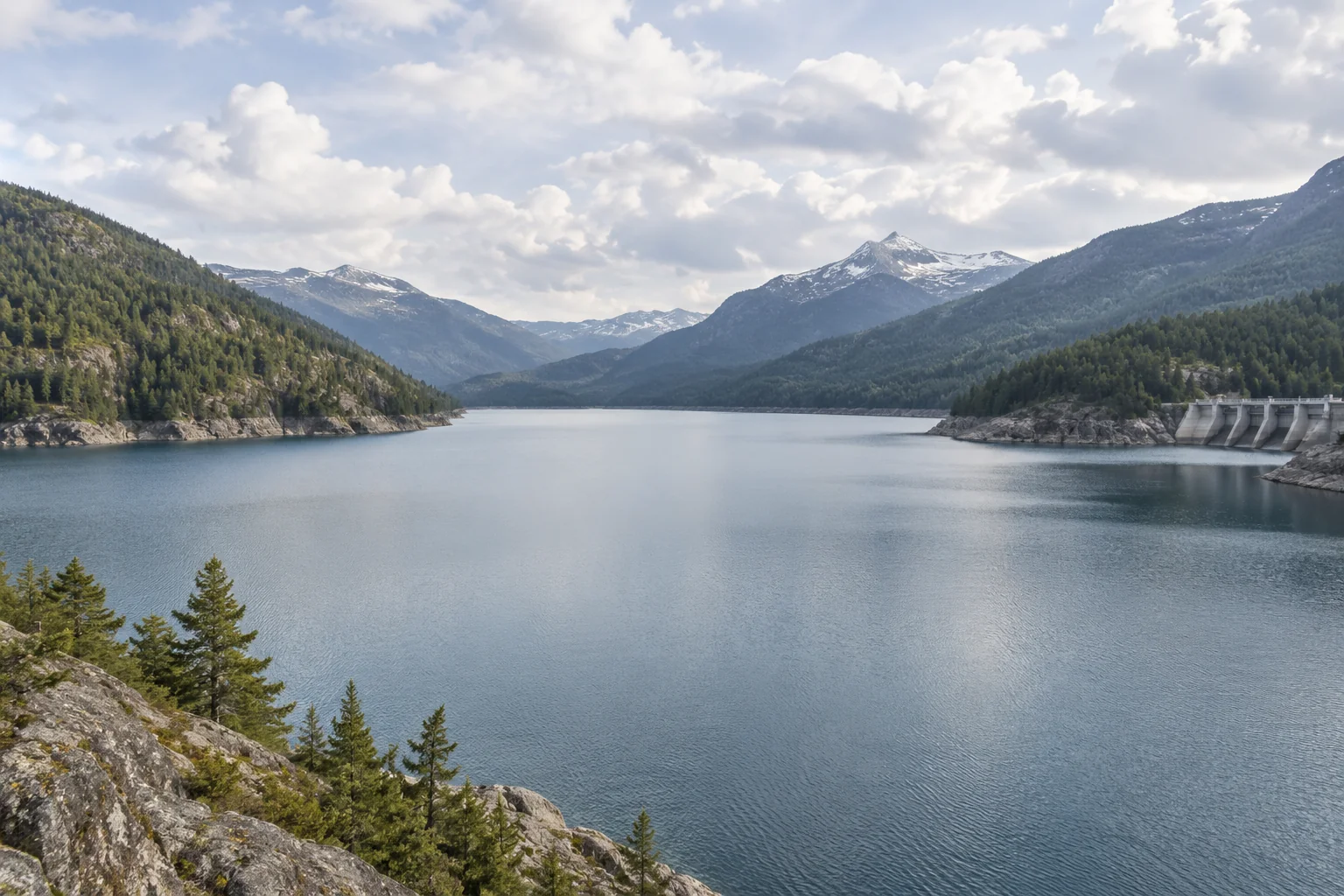 A reservoir with open water between the surrounding hills.